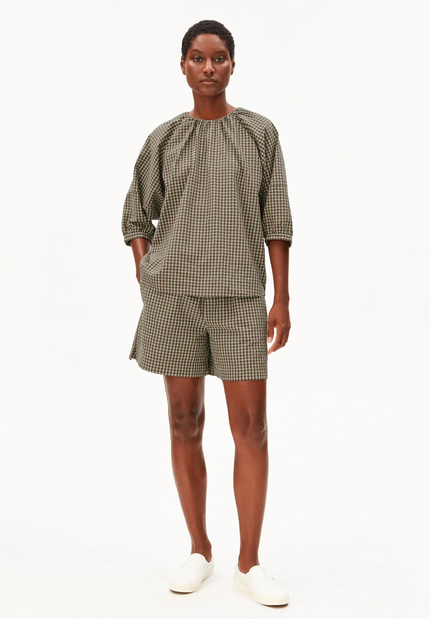 Full model shot in green and brown check cotton shirt and shorts for Kelowna and Canada