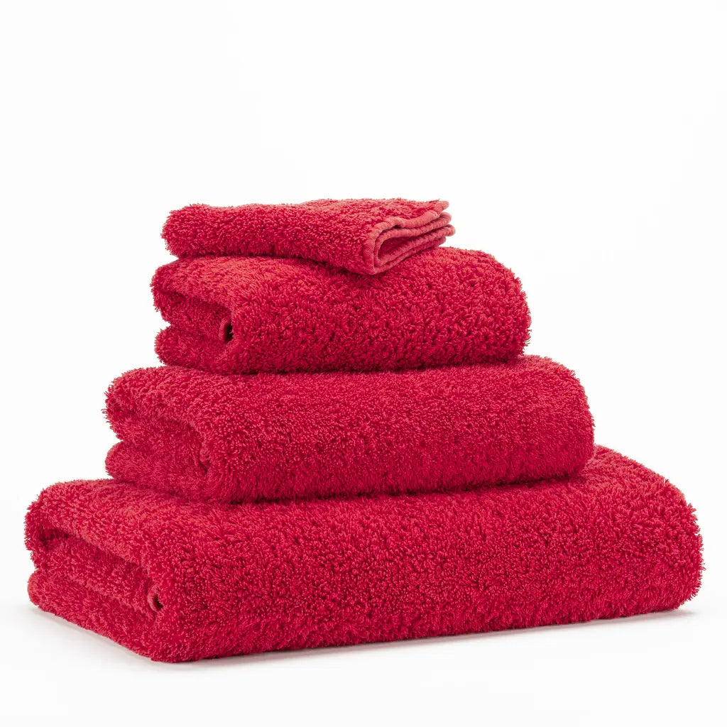 Stack of red towels on a white background