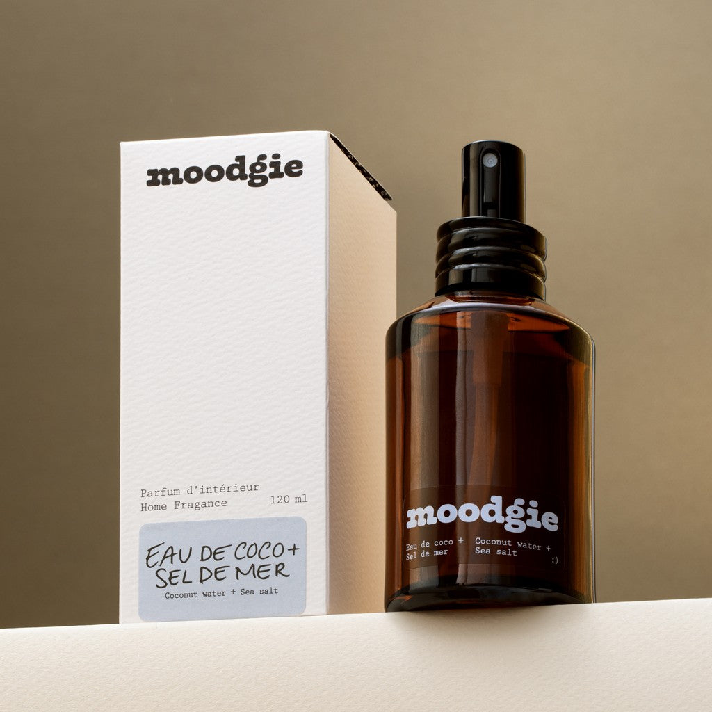 moodgie home fragrance bottle and packaging on a neutral background