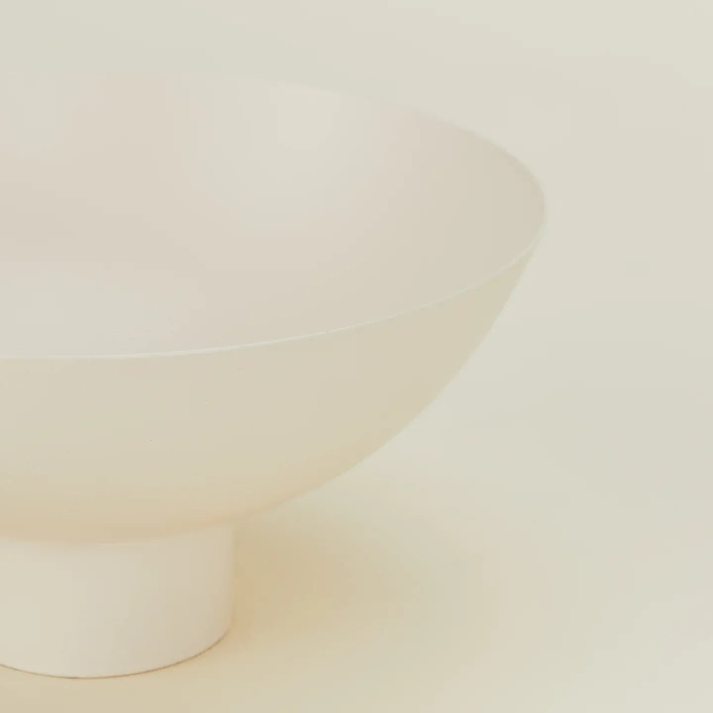 Close-up of an ivory bowl on a beige background