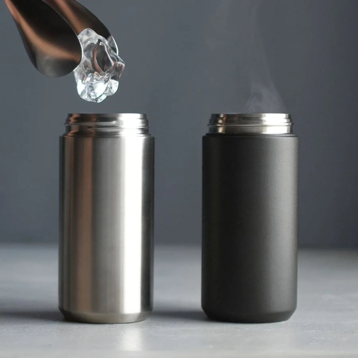 KINTO TRAVEL Tumbler in Stainless Steel and black holding a hot and cold drink