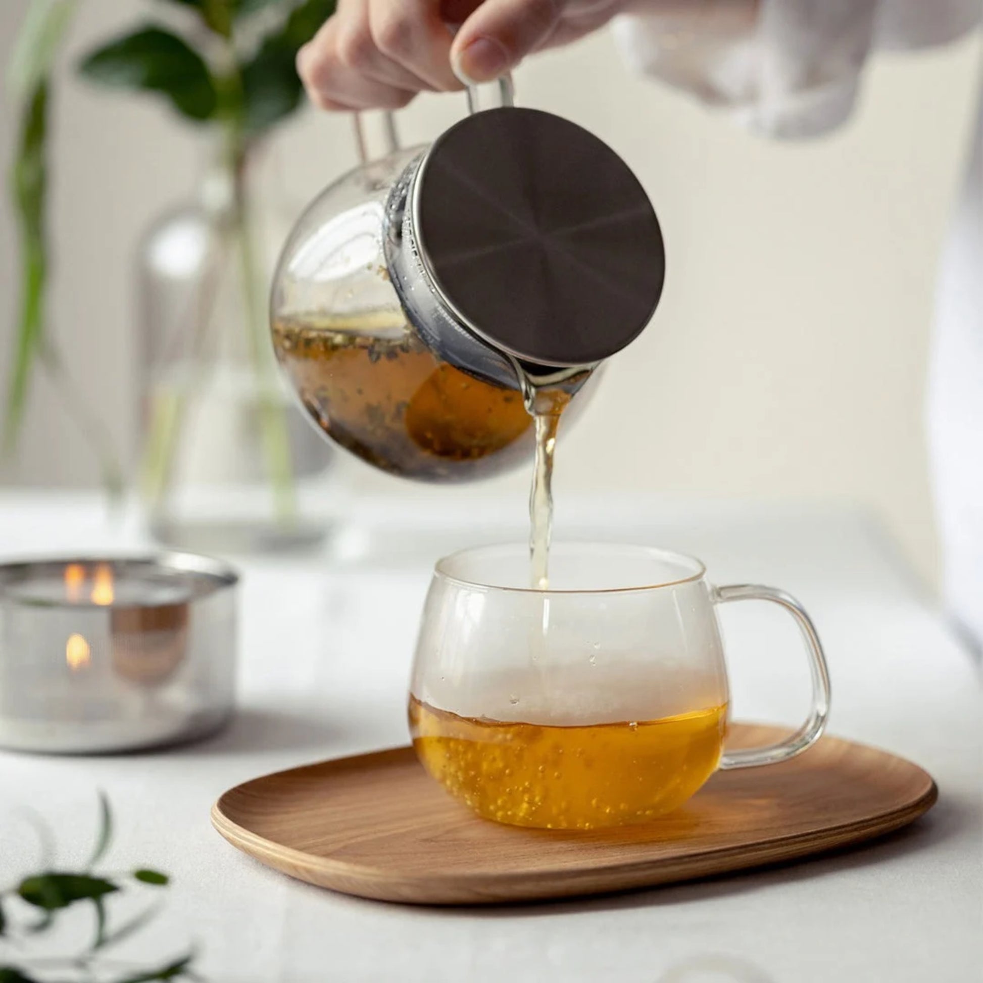 Tea being poured into KINTO UNITEA Teacup and Willow Tray