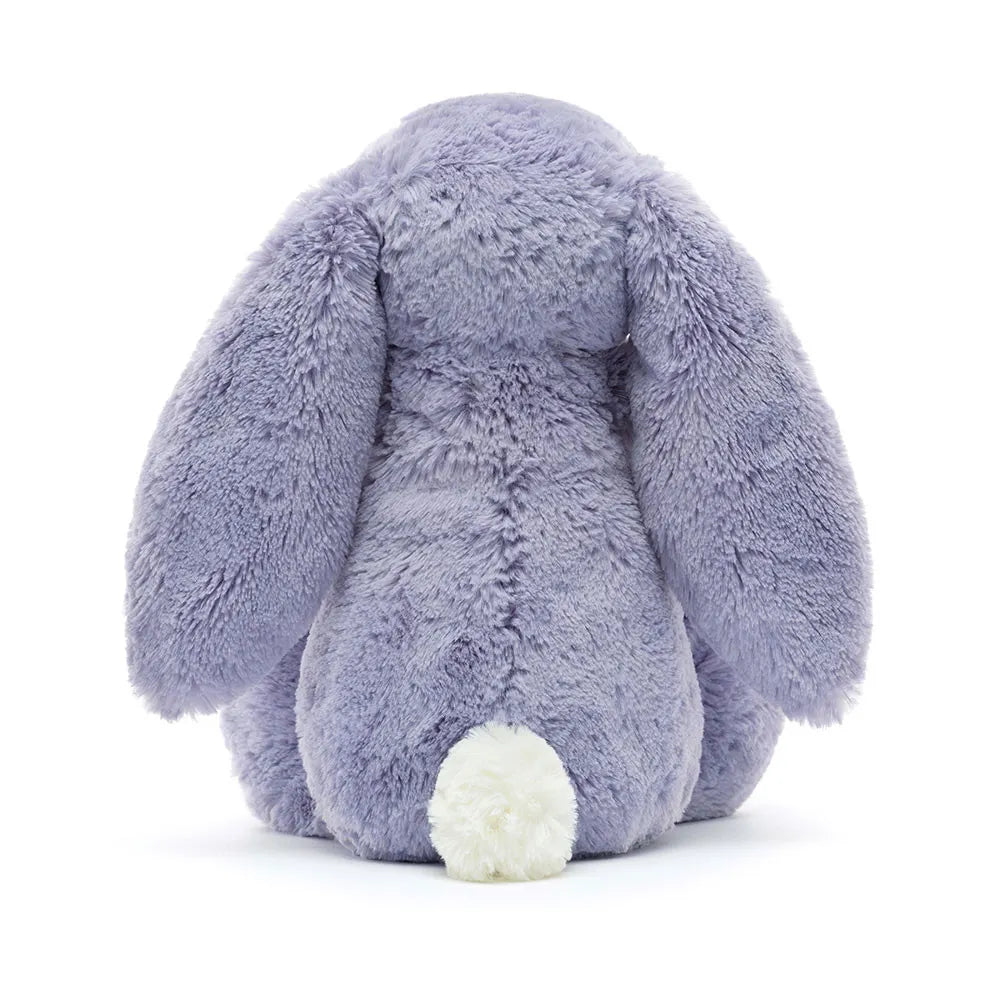 Plush lavender bunny toy on a white background