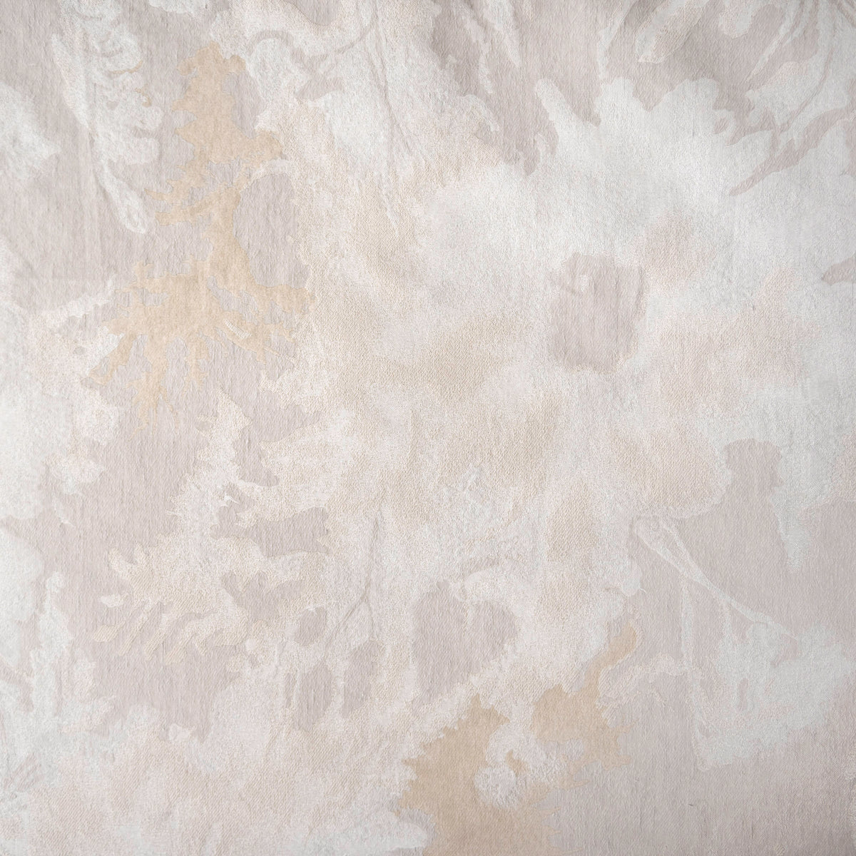 Close-up swatch of the Blossom jacquard in Parchment, with creamy white and pale gold abstract florals.