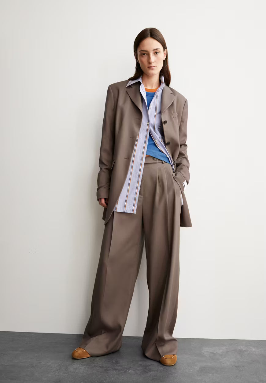 woman in armedangels canada brown pants