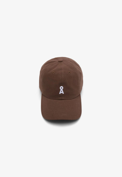Brown cap with a small white logo on a white background