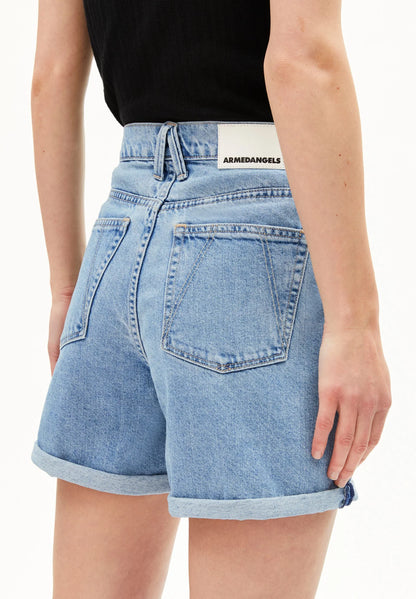 Backside of light blue denim shorts worn by a person on a white background for Kelowna and Canada