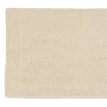 Beige bath mat on a white background