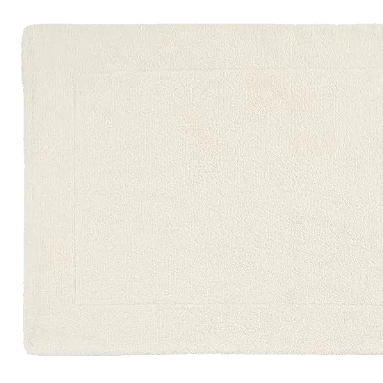 Beige textured rug on a light gray background