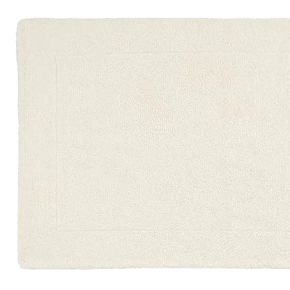 Beige textured rug on a light gray background