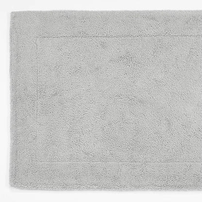 Gray bath mat with a textured surface on a white background