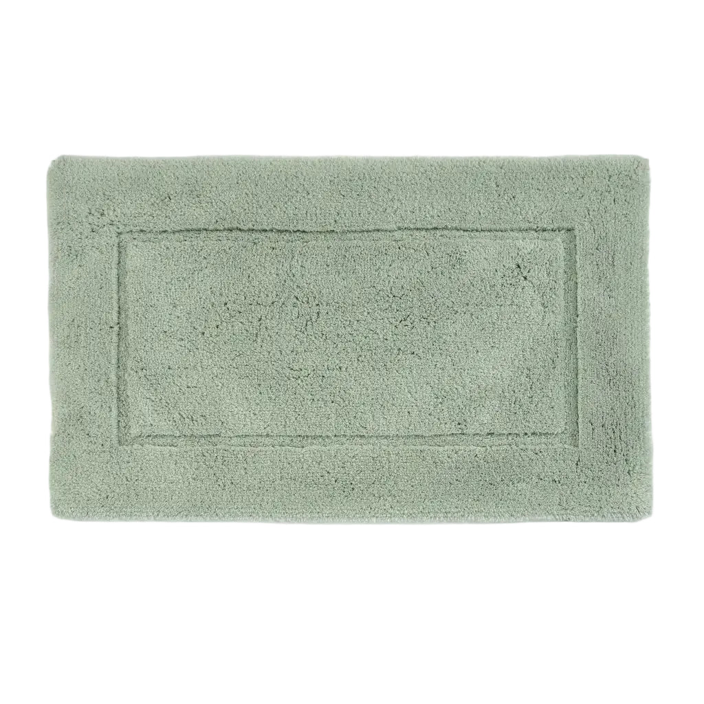 Green bath mat on a white background