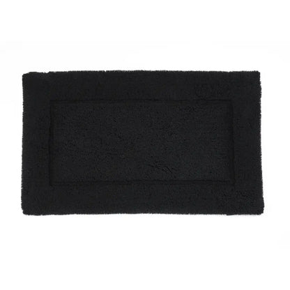 Black rectangular bath mat on a white background