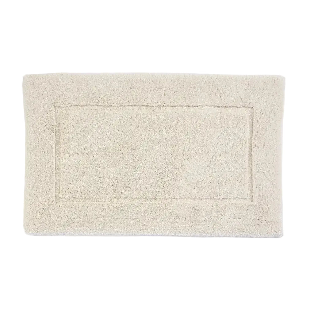 Beige bath mat on a white background