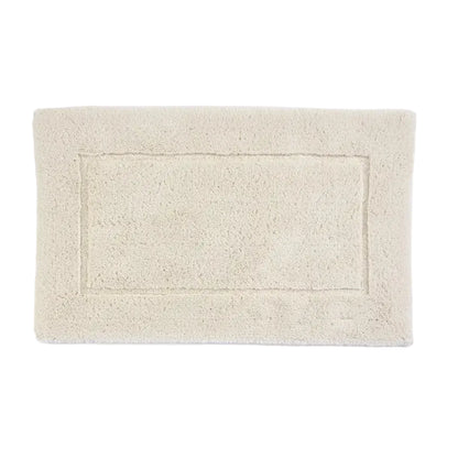 Beige bath mat on a white background