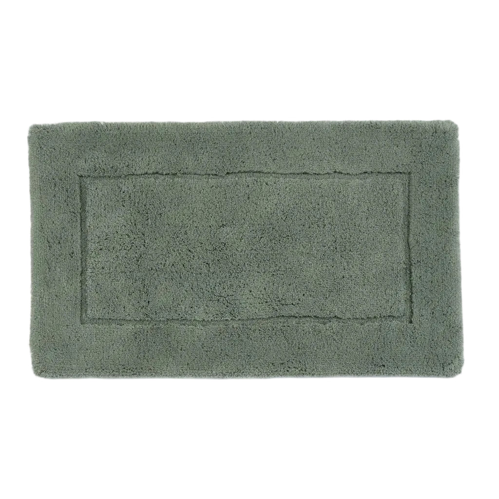 Green bath mat on a white background