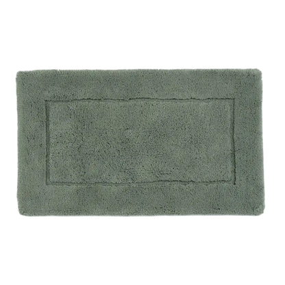 Green bath mat on a white background