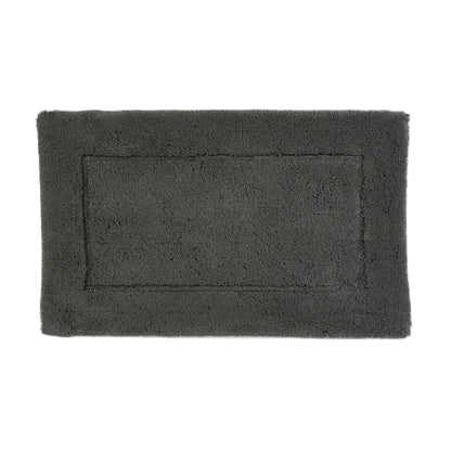Rectangular dark gray bath mat on a white background
