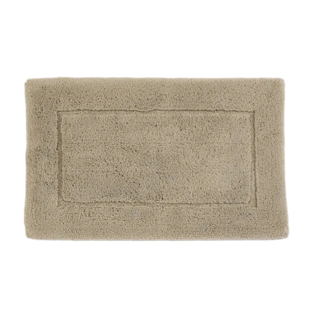 Beige bath mat on a white background