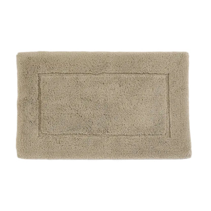 Beige bath mat on a white background