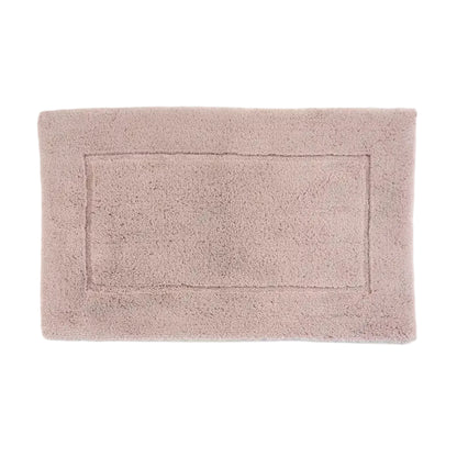 Light pink bath mat on a white background