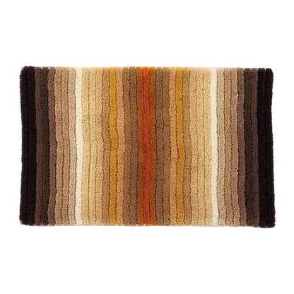 Striped bath mat with brown, beige, and orange colors on a white background