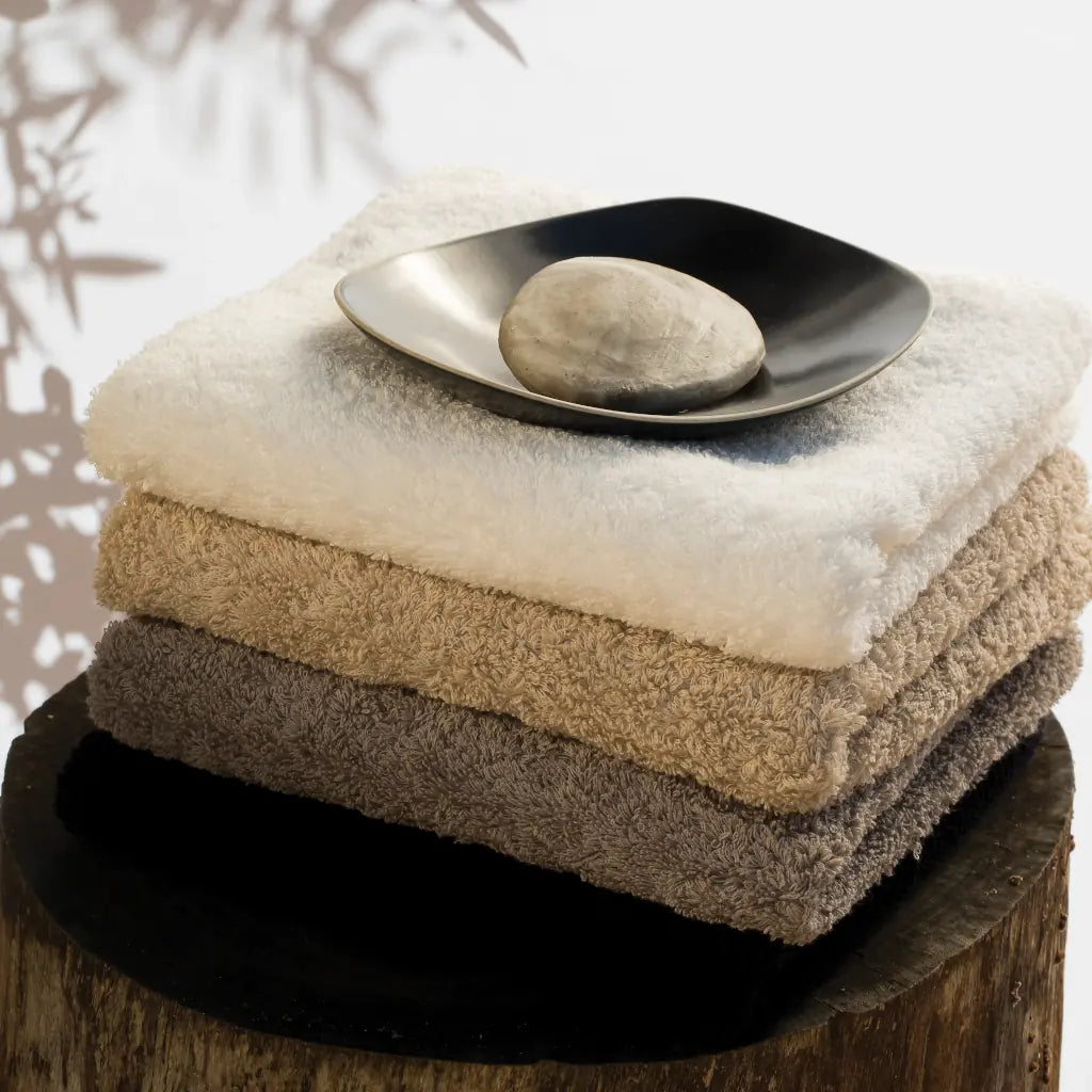 Stack of Abyss & Habidecor Super Pile Towels in Neutral Colours