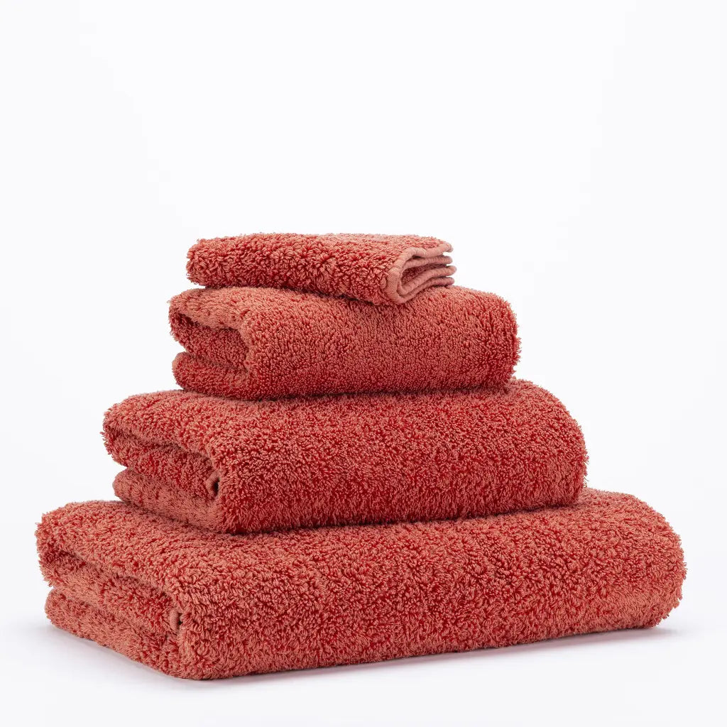 Stack of red towels on a white background