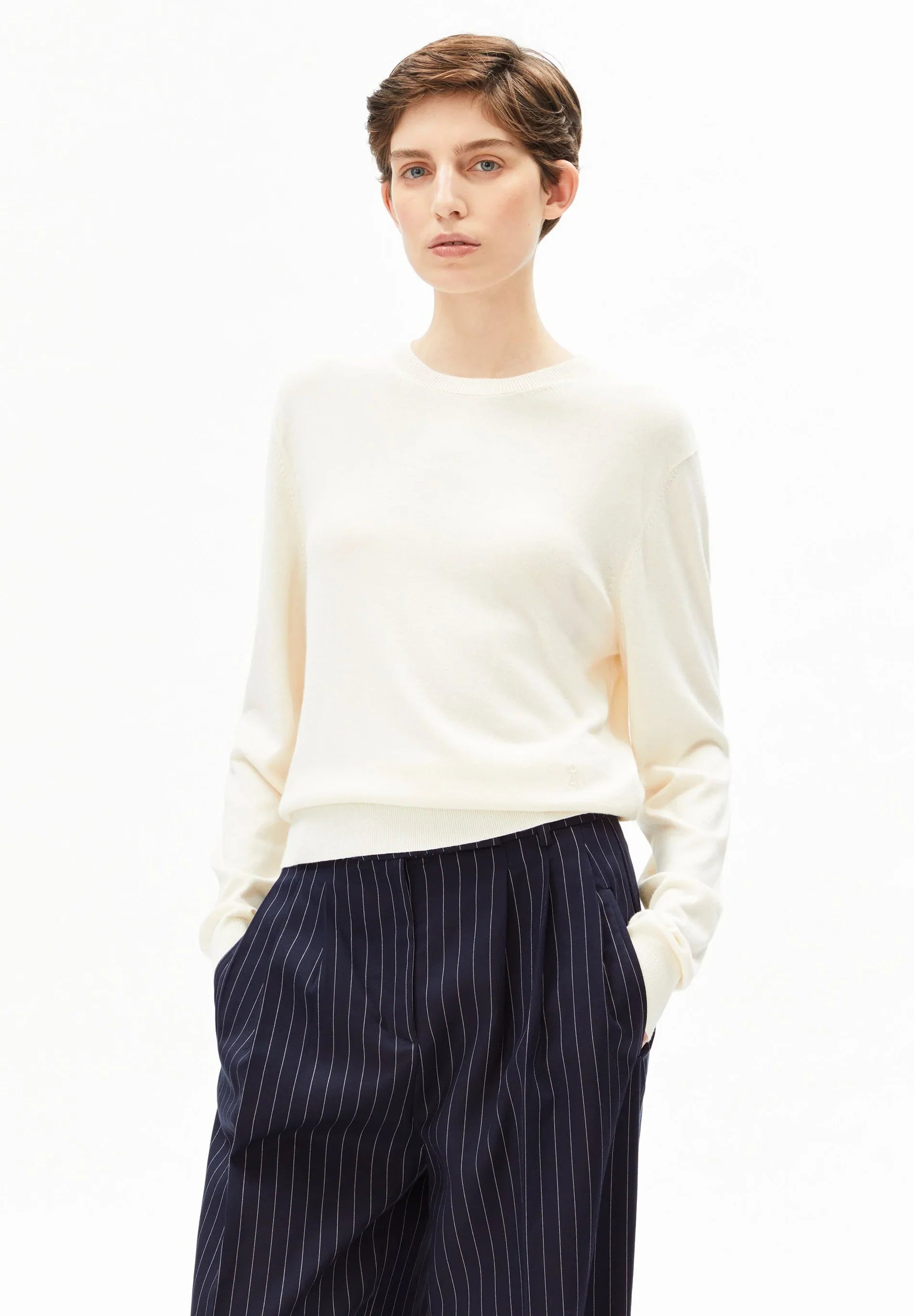 Woman wearing oatmilk fine knit sweater with short sleeves - ARMEDANGELS organic cotton sustainable knitwear Canada