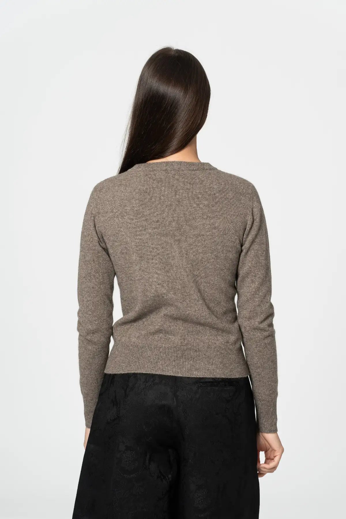 Back view of a Dinadi cardigan in a soft brown hue, perfect for layering and versatility  in Kelowna and Canada