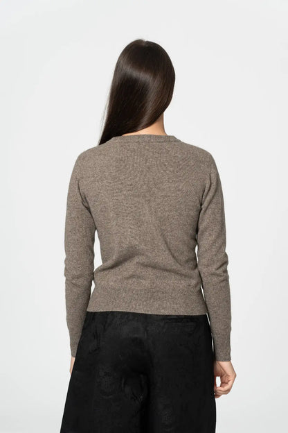 Back view of a Dinadi cardigan in a soft brown hue, perfect for layering and versatility  in Kelowna and Canada