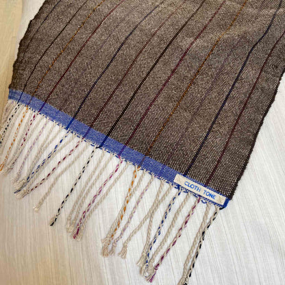 Close-up of woven fabric with a label on a white background