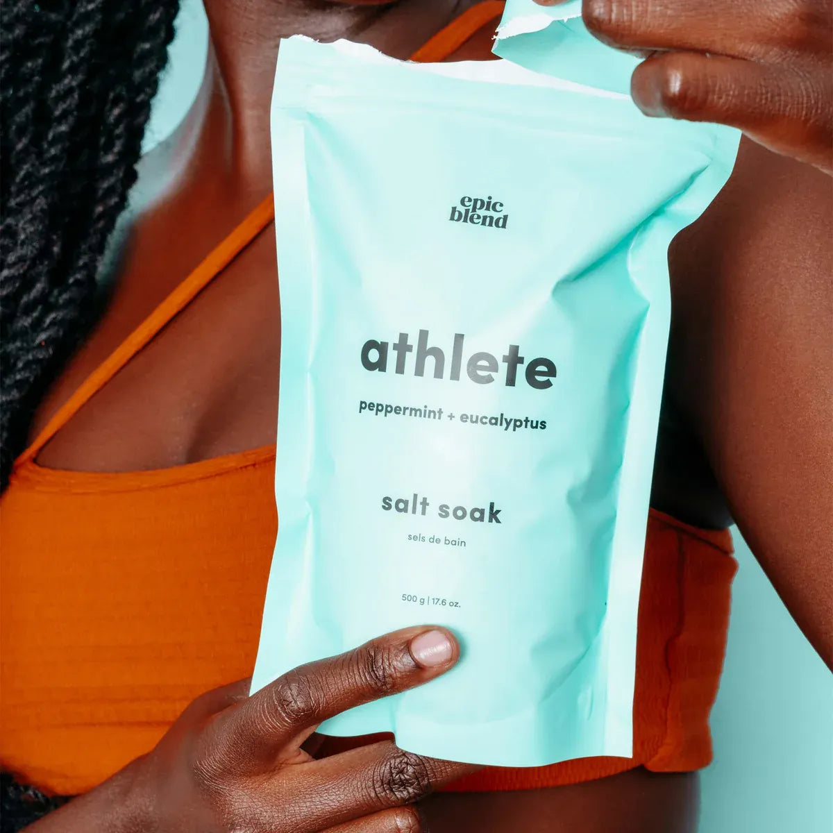 Person holding a 'athlete salt soak' package by Epic Blend
