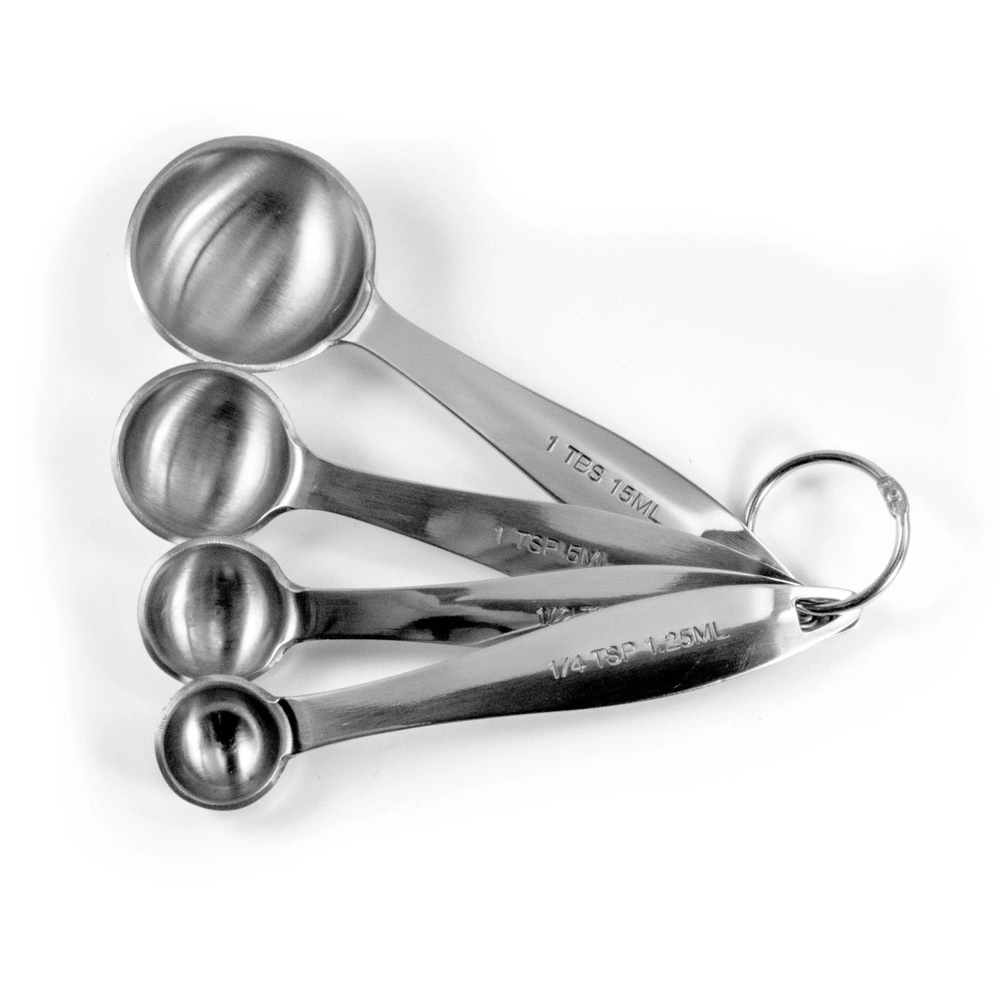 Set of stainless steel measuring spoons on a white background