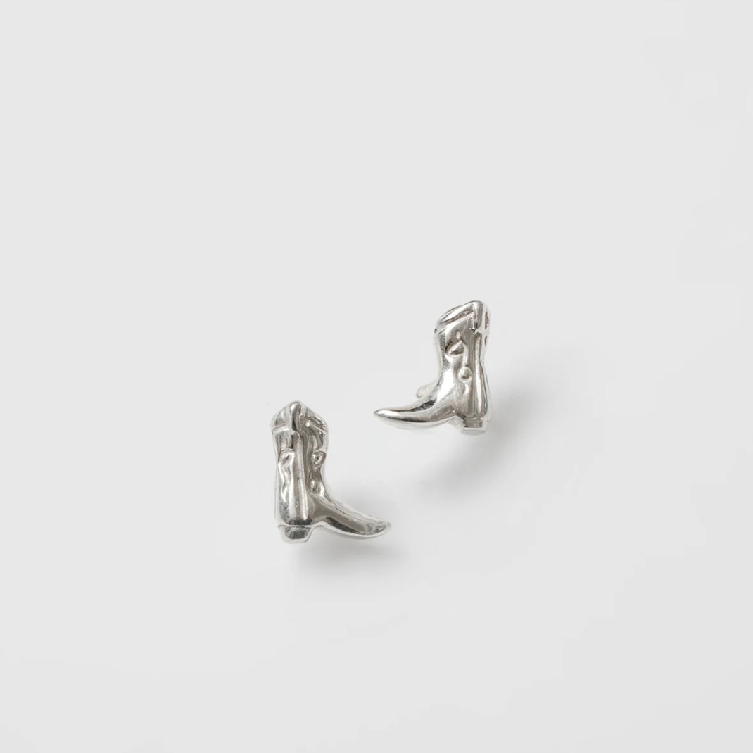 A pair of sterling silver stud earrings designed to resemble cowboy boots, displayed against a white background.