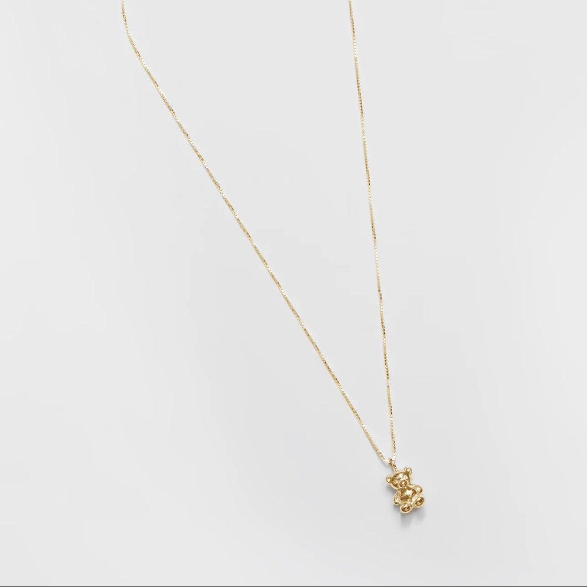 Wolf Circus teddy bear necklace in gold