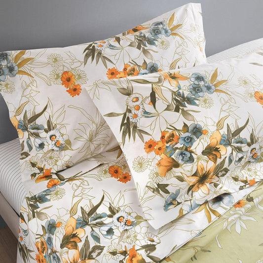 Floral patterned bed sheets with orange and blue flowers on a white background
