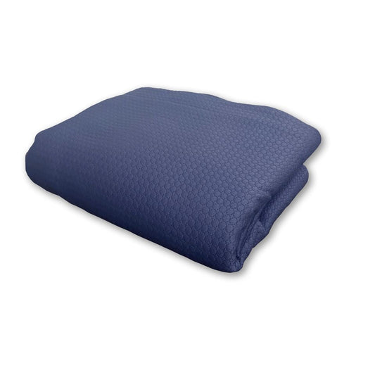 Folded blue blanket on a white background