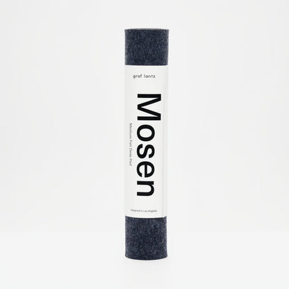 Roll of fabric with 'Mosen' branding on a white background