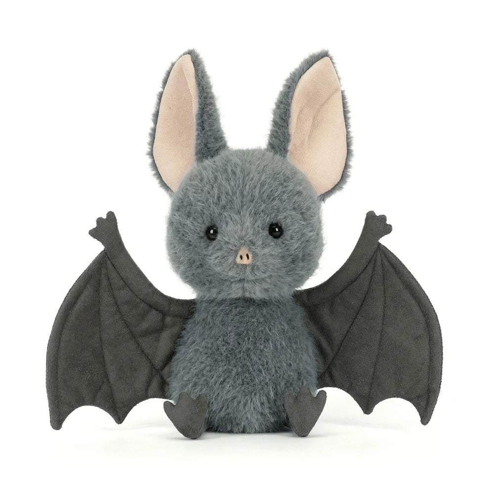 Plush toy bat with gray body and black wings on a white background