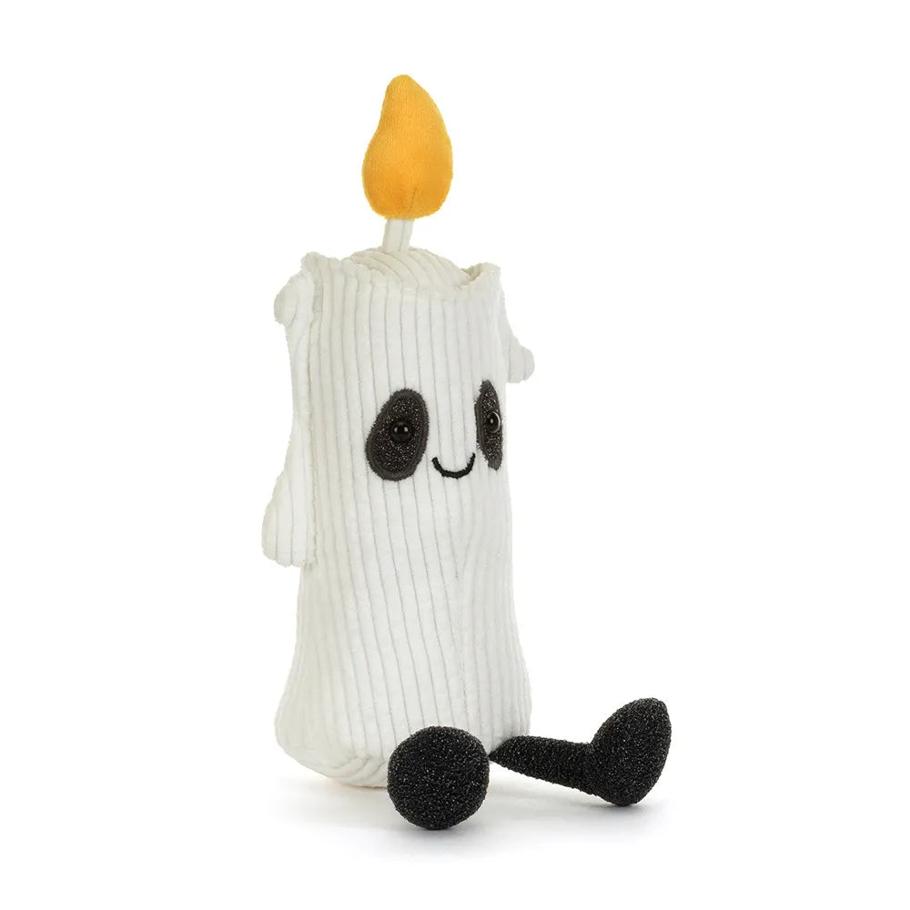 A white ghost candle plush toy with a yellow-orange flame on top, black embroidered eyes and mouth, and black feet, shown on a plain white background.