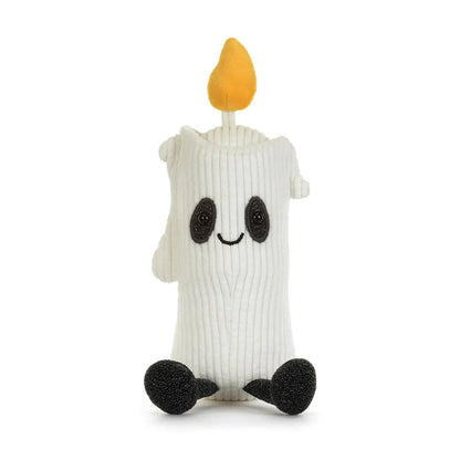 A white ribbed plush toy shaped like a candle with a yellow flame on top, black embroidered eyes and smile, and black feet, shown on a plain white background.
