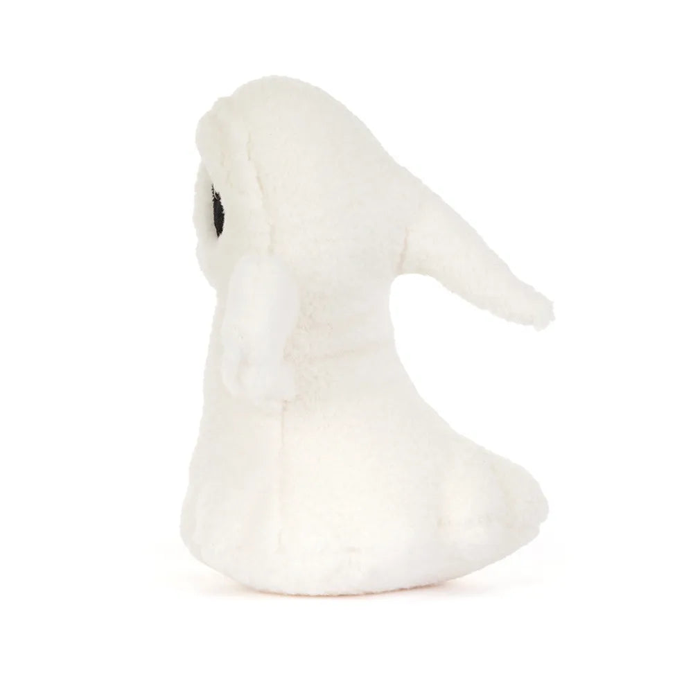 A small white plush ghost toy with a black eye, photographed against a seamless white background.