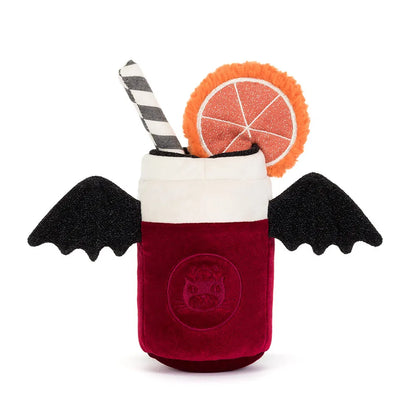 A plush vampire cocktail toy featuring a deep red velvet-textured body, black bat wings, a white foam top, a black-and-white striped straw, and an orange slice garnish, shown on a plain white background.