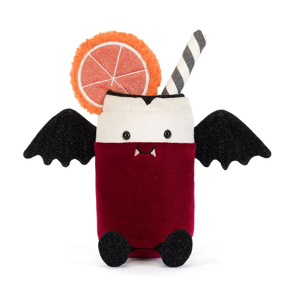 A plush vampire cocktail toy on a white background. The toy features a deep red body, a white collar, black bat wings, small black feet, and a black-and-white striped straw.