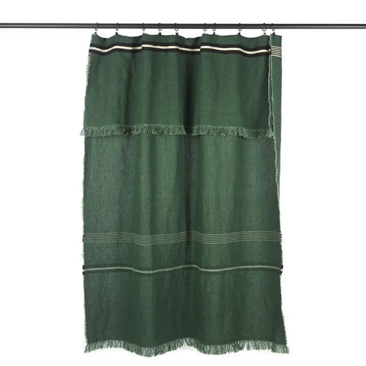 A dark green woven textile panel with horizontal stripes and fringe trim, hanging from a black rod against a plain white background.