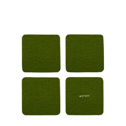 Four green coasters with 'graf lantz' branding on a white background