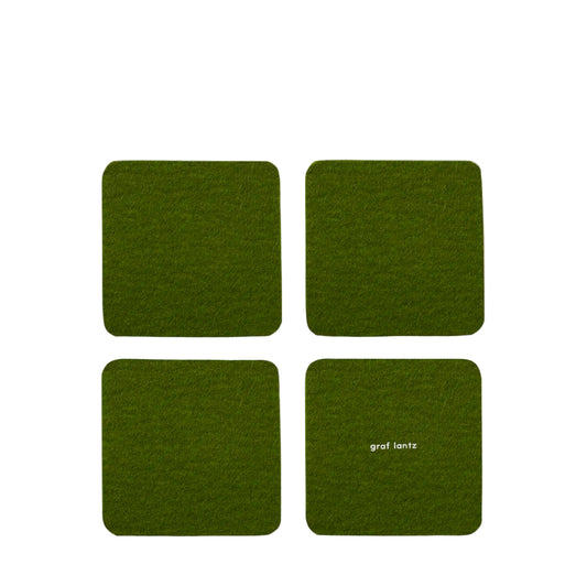 Four green coasters with 'graf lantz' branding on a white background