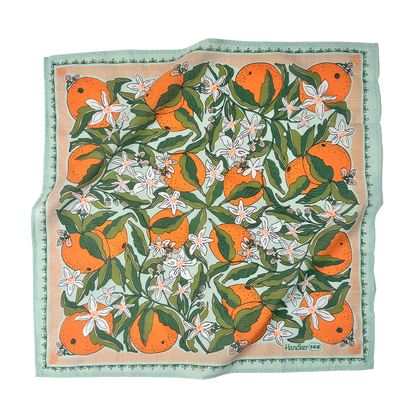 Square scarf with orange and floral pattern on a white background