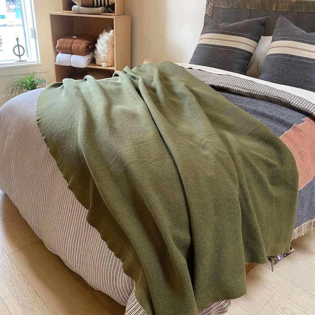 Hawkins New York wool knit throw in an olive colour